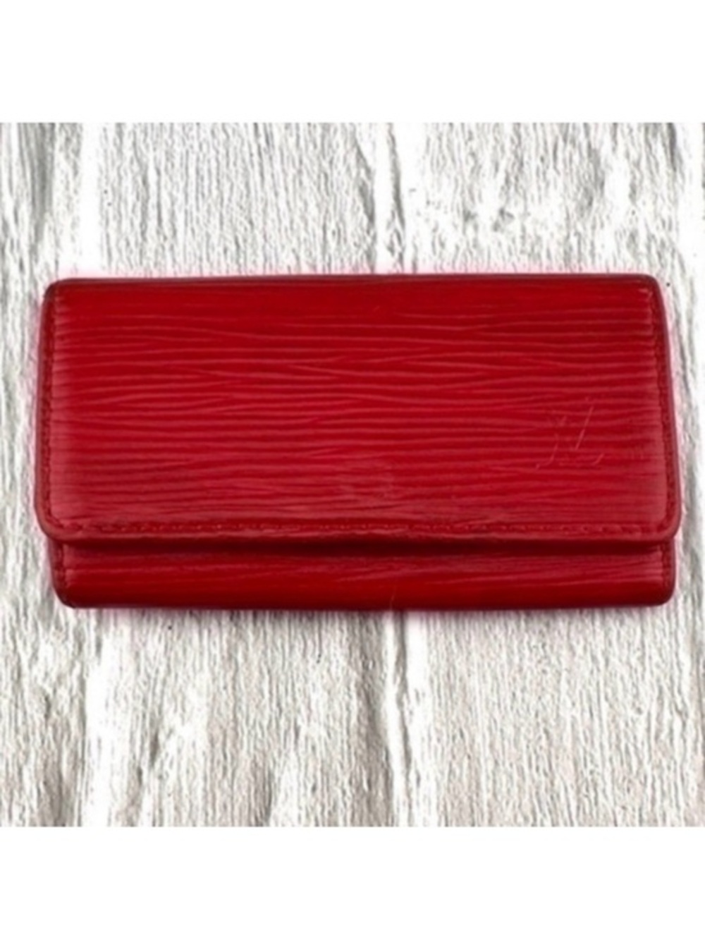 AUTHENTIC Louis Vuitton key holder. Previously owned. Color:Red